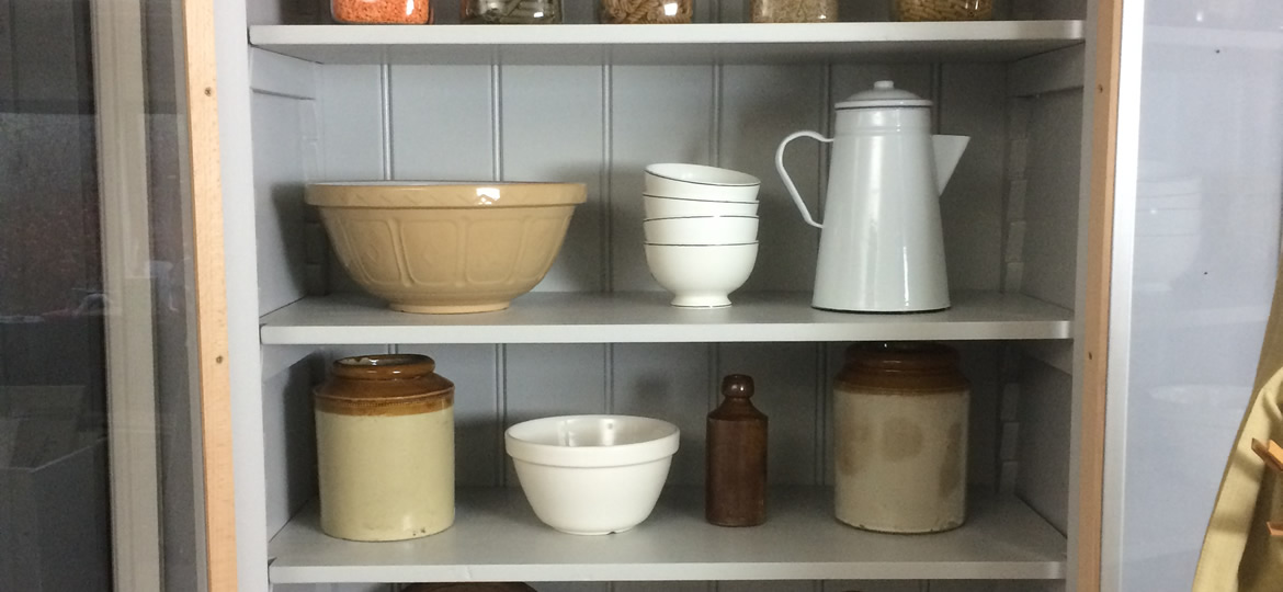 Freestanding larder cupboard with glazed doors & adjustable shelves