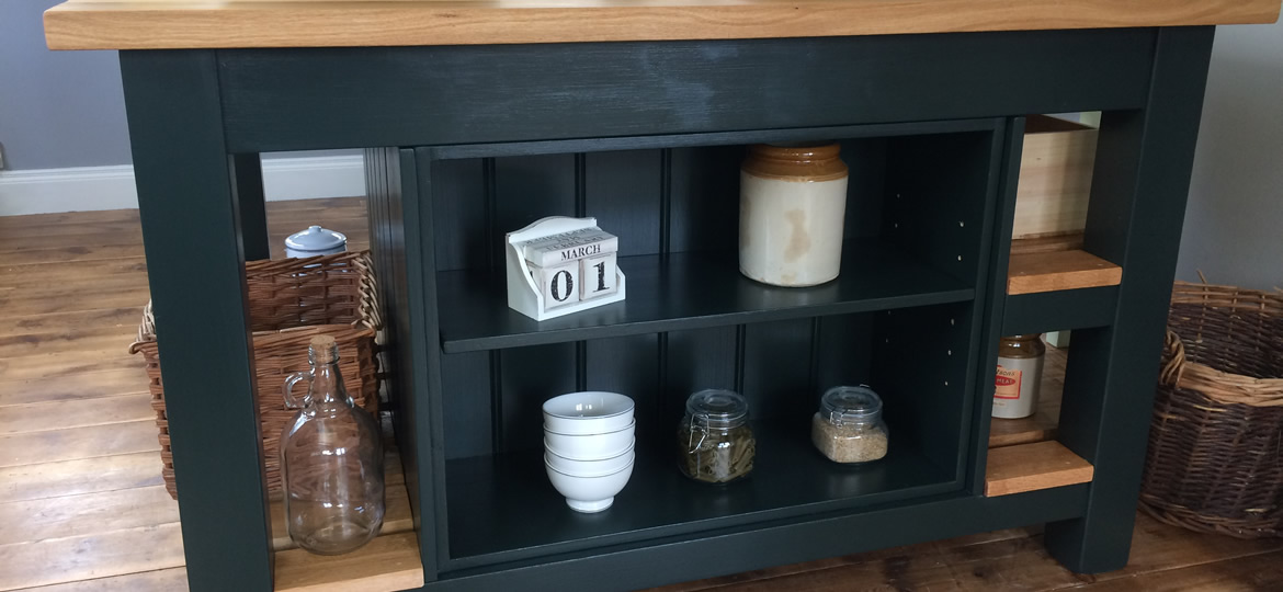 freestanding kitchen island with integral bookcase & fitted with a solid oak worktop