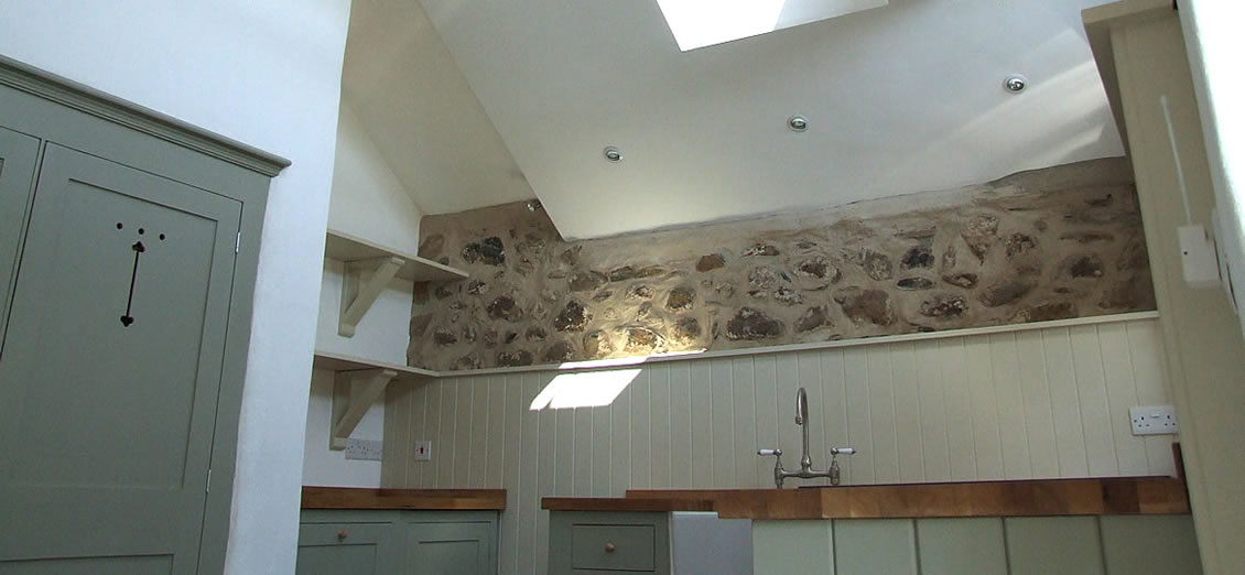 bespoke painted shaker kitchen installed in an old barn near st davids, wales