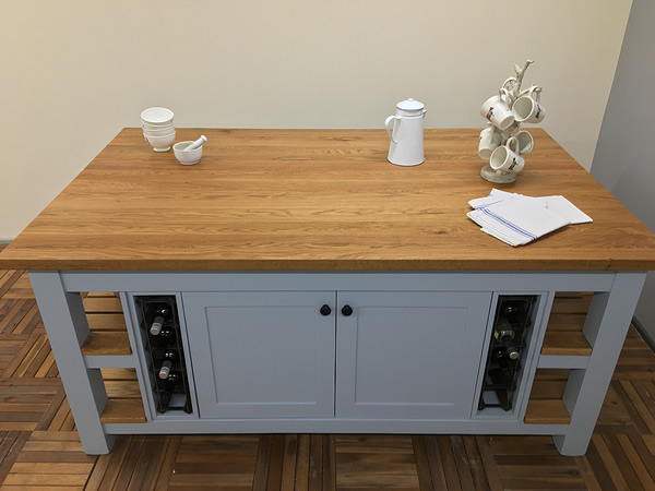 large freestanding kitchen island fitted with solid timber planked oak worktop