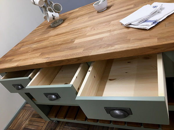 large freestanding kitchen island incorporating 3 deep dovetailed drawers