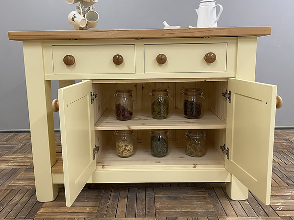 medium kitchen island with a double door storage cupboard
